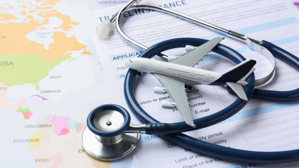 Travel insurance documents with a stethoscope and model airplane